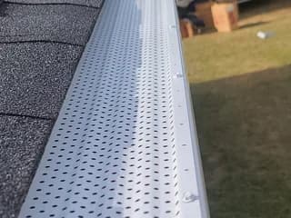Close-up of a seamless gutter with guard