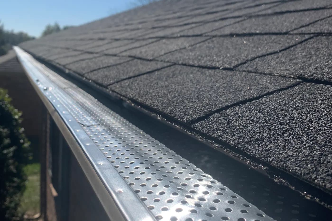 Roof edge showing gutter with guard protection installed